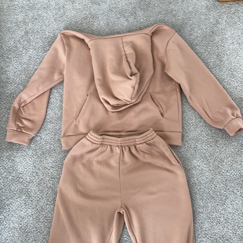 Light brown sweatsuit. Medium